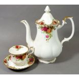 A Royal Albert Country Roses tea service comprising: six cups & saucers, six tea plates, coffee pot,