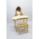 A vintage French style cream painted kidney form dressing table with oval mirror and wicker back