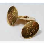 A pair of 18 carat gold cufflinks with engraved decoration, 5.6g