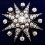 A Victorian gold and silver star form diamond pendant brooch, 3.1cm diameter, 10.5g, the central