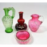 Two Victorian floral painted glass jugs, a ruby glass carafe painted flowers and a cranberry glass