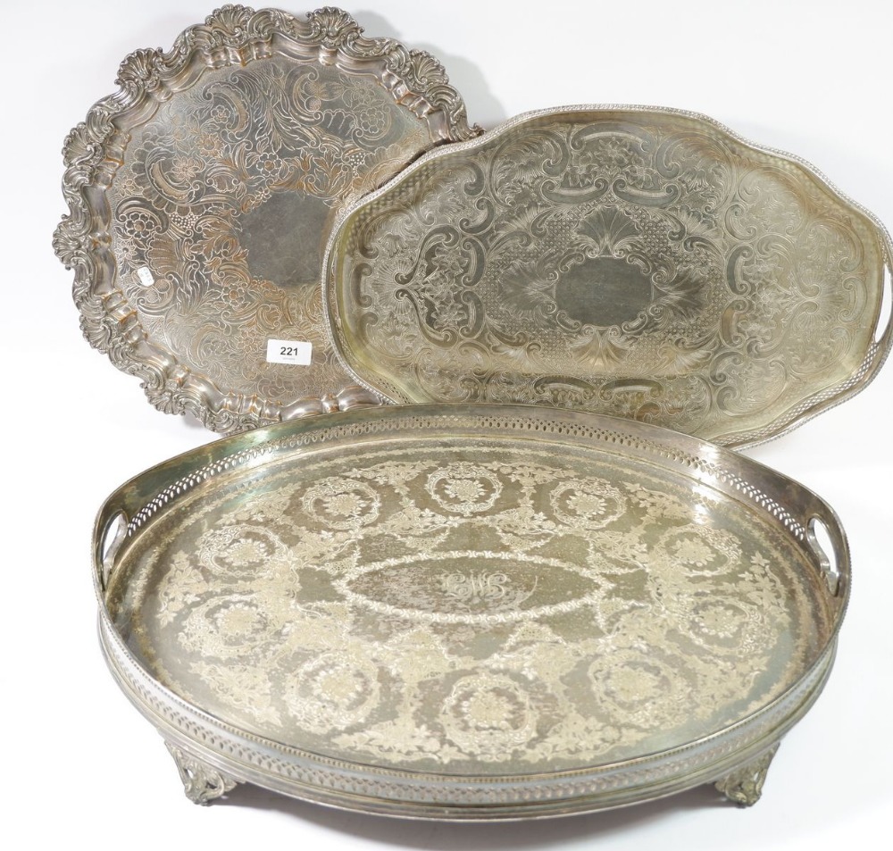 Two oval silver plated galleried trays and another circular tray with shell edge