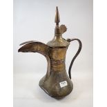 A 19th century large brass Turkish coffee jug, 41cm tall