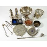 A group of silver plated items including two silver plated sugar sifters, a wine bottle coaster etc.