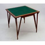 A baize top folding card table