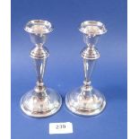 A pair of silver candlesticks, 16cm