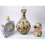An Isnik pottery vase and cover, a/f 32cm, a frog tobacco jar a/f and a faience flask