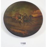 A Russian lacquer plate painted sleigh scene, 18cm diameter, gilt mark to verso