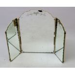A vintage triple folding dressing table mirror