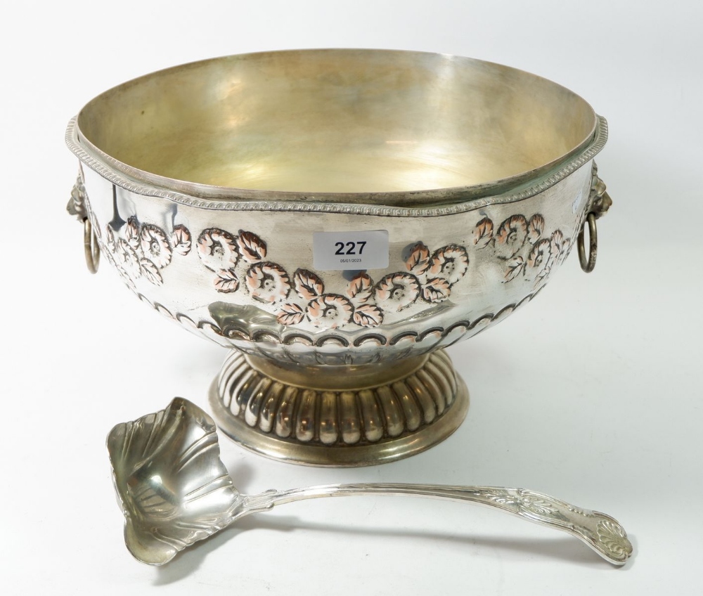 A large silver plated punch bowl embossed floral decoration with ladle