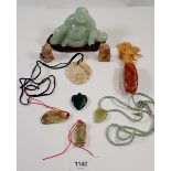 A 'jade' Buddah on stand and various oriental agate stone necklaces etc