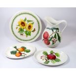 A Portmeirion Botanic Garden large cake stand, large jug and two oval platters