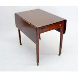 A Georgian mahogany Pembroke table on square tapered supports