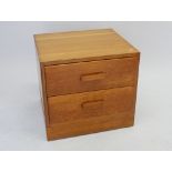 A Leigh oak unity bedside chest of two drawers 55cm wide x 48cm deep x 50cm tall