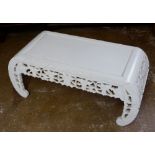 A Chinese hard wood carved low coffee table, later painted white, 100 x 41cm