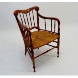 A Victorian beech turned open armchair with turned spindles back and arm supports, string seat a/f