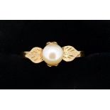 An 18 carat gold ring set pearl, size L