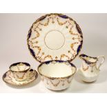 A Royal Albert Edwardian tea service with floral swag decoration comprising: seven cups and two