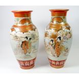 A pair of Japanese large satsuma vases painted figures in a landscape, one with hairline, 33cm tall