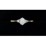 A 9 carat gold ring set opal flanked by two chip diamonds, size M