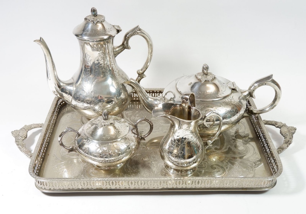 A silver plated four piece tea service on a silver plated tray