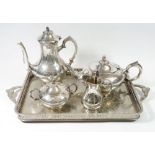A silver plated four piece tea service on a silver plated tray