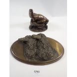 A filled bronze finish group of seals by Elton, 13cm tall and a dog plaque by June Connors, 25cm