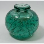A Victorian green bubbled glass dump weight inkwell, 13cm tall
