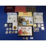 A miscellaneous lot of coinage including: Royal Mint folder £1 issues 1970 set, brass threepence