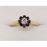 A 9 carat gold sapphire and diamond cluster ring, size P