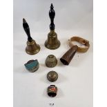 A collection of seven bells including cow bells