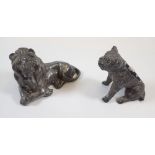 A Victorian pewter model of lion 8cm long and a spelter bull dog pin cushion with glass eyes