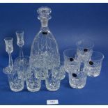 A Webb cut glass decanter, four Webb cut glass tumblers, two thistle form liqueur and six cut