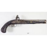 An 18th century Indian flintlock pistol with engraved steel lock and inlaid silver wire decoration