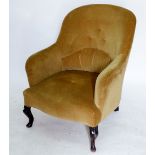 An Edwardian tub chair with button upholstery