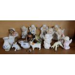 A group of ornaments to include two Beswick birds, Mrs Tiggywinkle and various angel figures etc