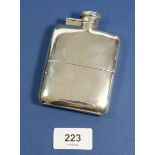A silver hip flask with removable beaker base and swivel lid, 165g, Birmingham 1916, W M Neale Ltd