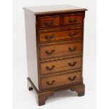 A reproduction mahogany small narrow chest of two short and five long drawers 47 x 38 x 84cm