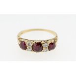 An 18 carat gold ruby and diamond ring, size Q