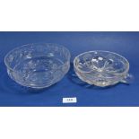 A cut glass bowl engraved roses and a two handled glass bowl