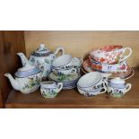 Two Victorian cups and saucers, a Japanese child's tea service and a Chinese teapot