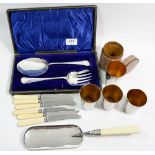 A set of four silver plated stacking tot glasses in leather case and various cutlery
