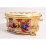 An early 19th century Derby bough pot and cover painted reserve of garden flowers in gilt scrollwork