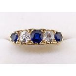 An 18 carat gold sapphire and diamond ring, size Q-R