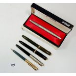 A Parker fountain pen boxed and four other Parker fountain pens