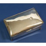 A silver clad cigarette box