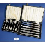 A set of six silver coffee spoons, Birmingham 1935 and a set of six tea knives, Sheffield 1866 -