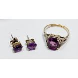 A 9 carat gold and silver amethyst ring, size O/P and a pair of matching earrings