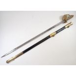 A Royal Navy officers sword the gilt handle with lions head pommel and white shagreen wire bound