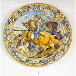 An Italian Maiolica plate painted soldiers - repaired, 44cm diameter